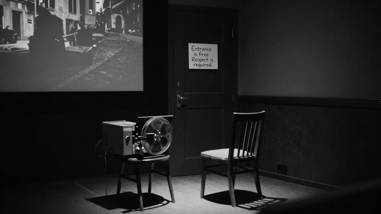 Empty screening room in Trastevere with handwritten sign, faint light from projector casting silhouette on floor.